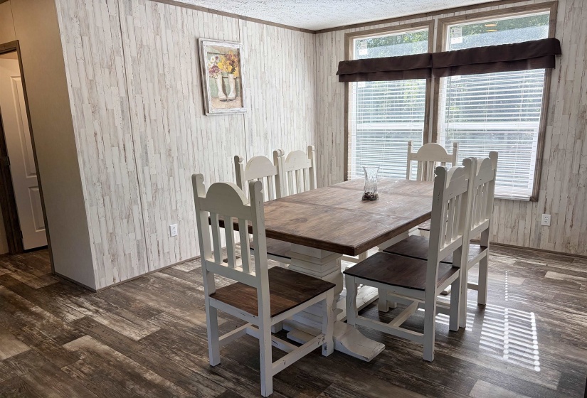 Light wood-finish paneling walls featuring dark wood trim