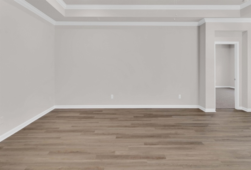 Unfurnished room featuring crown molding and light wood-type flooring