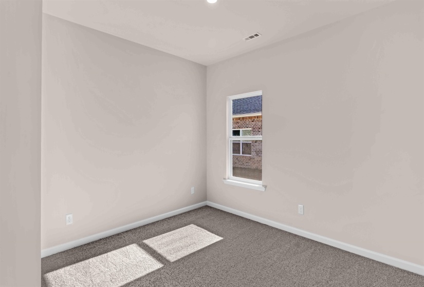 Carpeted empty room with baseboards