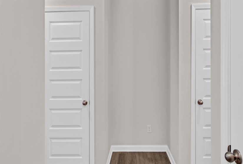 Detailed view of baseboards and wood finished floors