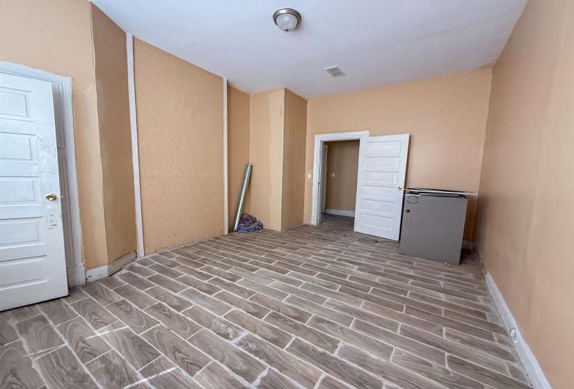 Wood-finish tile flooring throughout