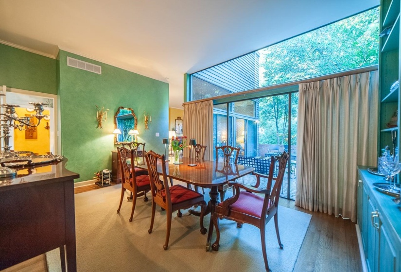 Floor-to-ceiling windows with lovelly views of  trees