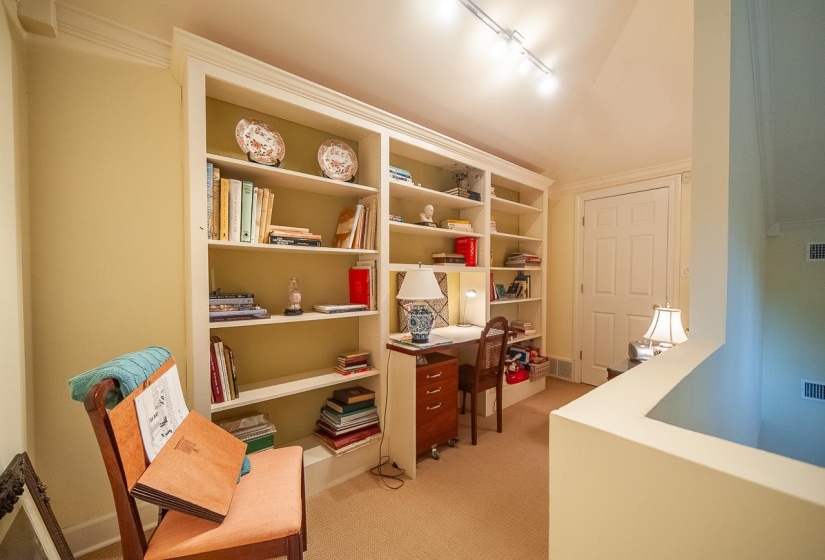 Interesting area tucked in a separated area upstairs perfect for an office not in anyone's way.... or a delightful reading nook...or a play area for a child. :)