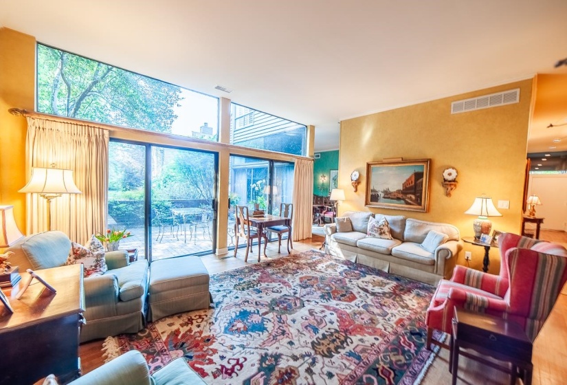 Expansive floor-to-ceiling windows with upper transoms and sliding glass doors. If you can see through the window notice the privacy! You do not see anyone right next to you. Feels very serene and woodsy...as it was designed to be.