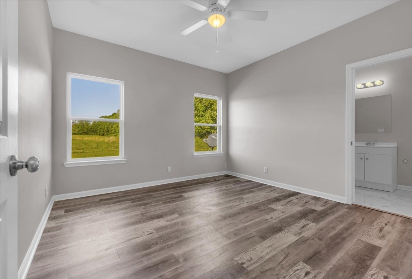 Spacious room with vaulted ceilings and wood-finish flooring