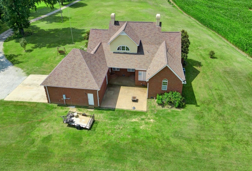 Brick exterior residence with a multi-gabled shingle roof