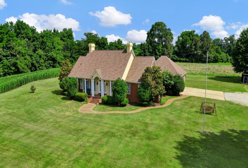 Traditional brick and siding exterior with a welcoming front porch