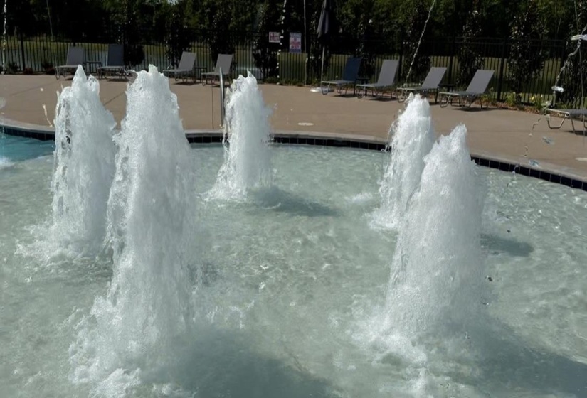 View of home's community with a swimming pool