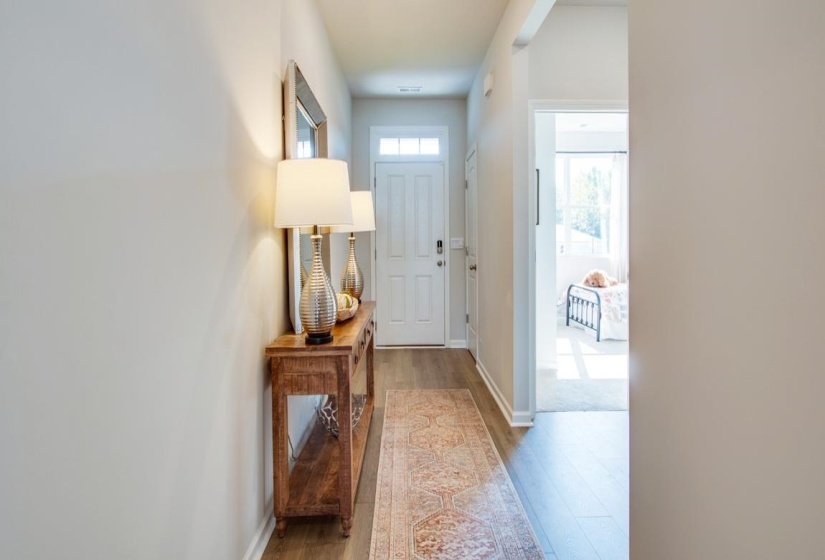 Doorway featuring wood-type flooring