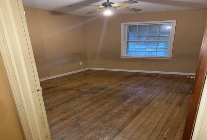 Hardwood flooring extending throughout the room