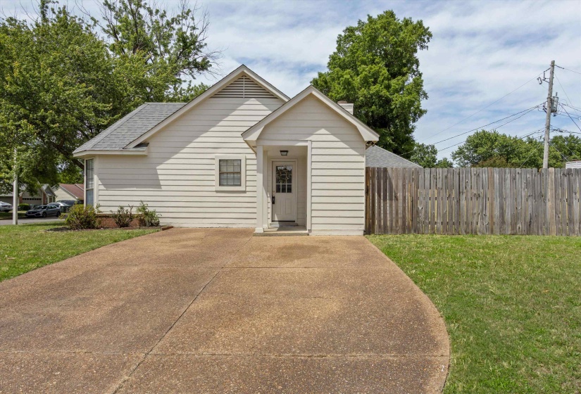Light-colored siding exterior featuring a covered entry porch
