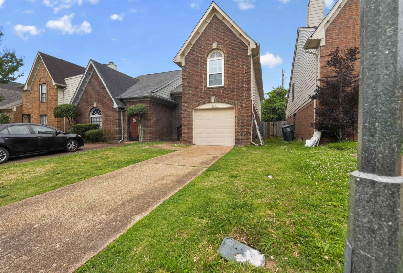 Brick exterior residence with an attached garage