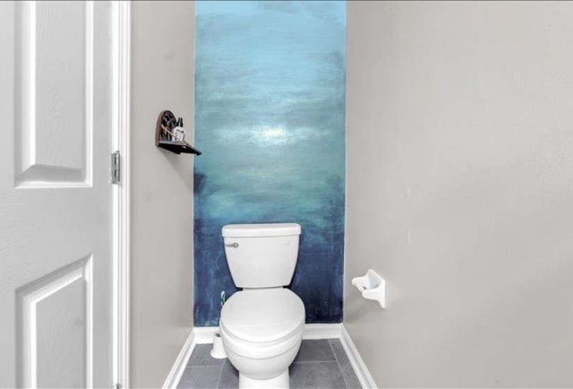 Neutral-toned walls complement a striking blue accent wall