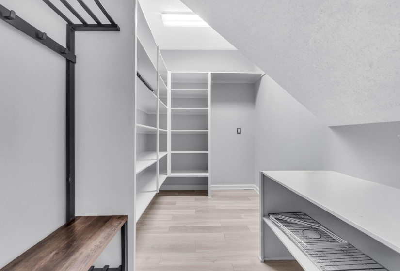 Built-in custom shelving system featuring white finishes