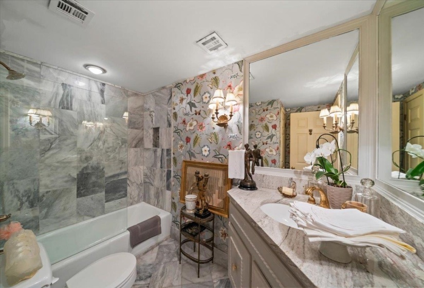 Full bath with vanity,  shower combination, and a chandelier