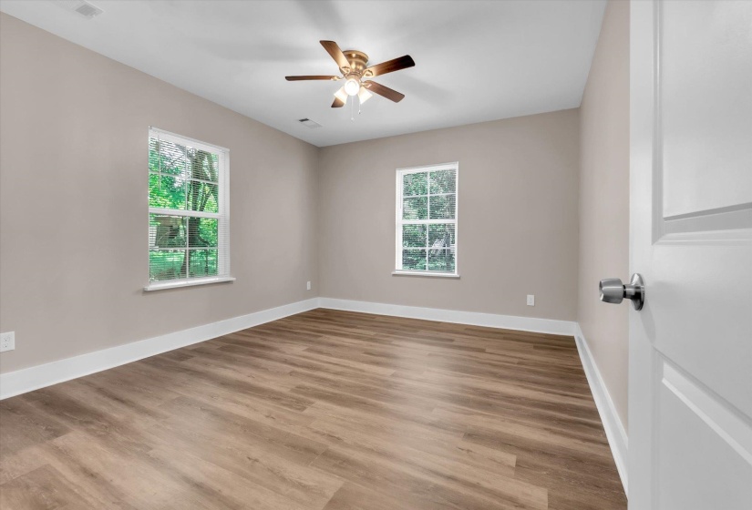 Neutral tone walls complement wood-finish flooring