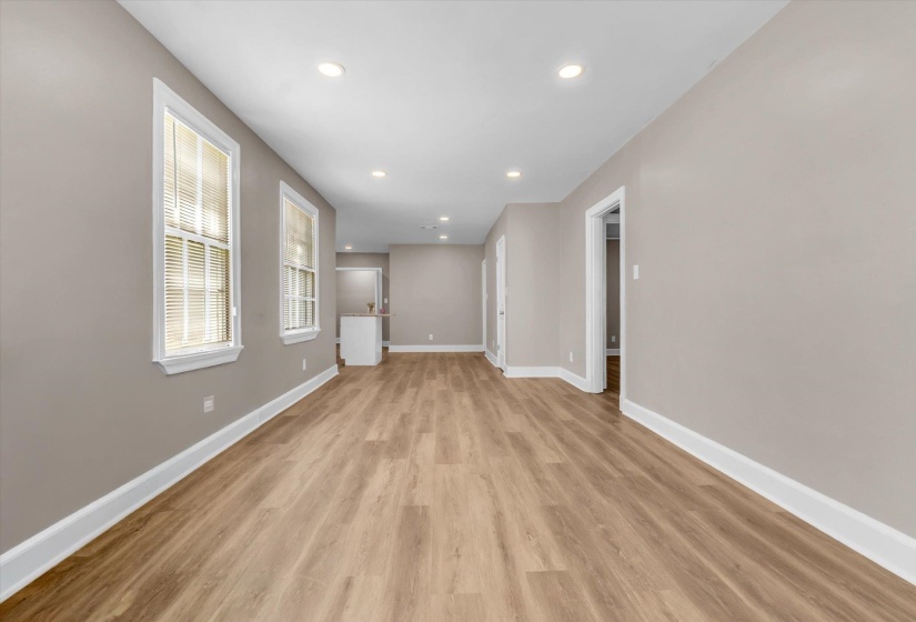 Spacious interior featuring wood-finish flooring, recessed lighting, and neutral wall tones
