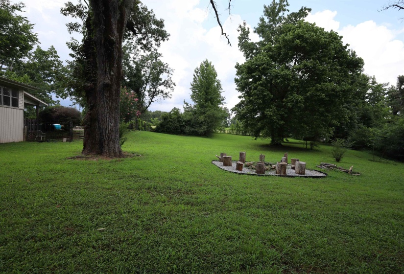 View of green lawn featuring a patio area