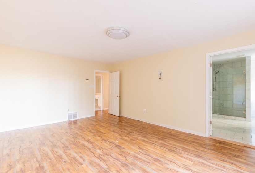 Spare room with light wood-style flooring and baseboards