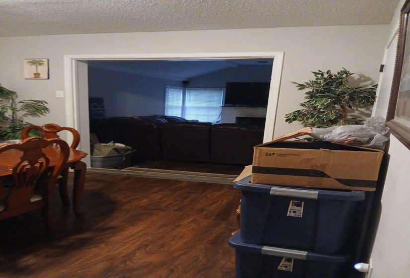 Wood-finish flooring extends throughout the space, complementing the light-toned walls
