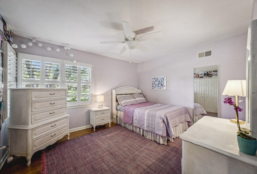 Hardwood flooring paired with white window shutters