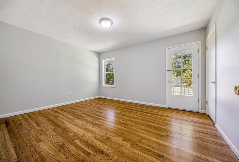 Spare room featuring a textured ceiling and light wood finished floors