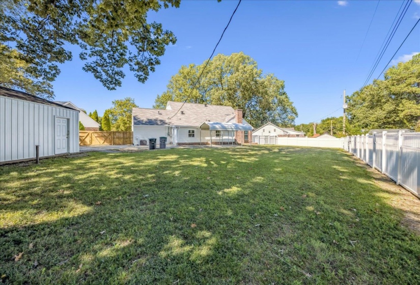 Fenced backyard with a patio area