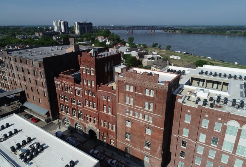 Historic brick architecture with arched windows and a prominent corner tower