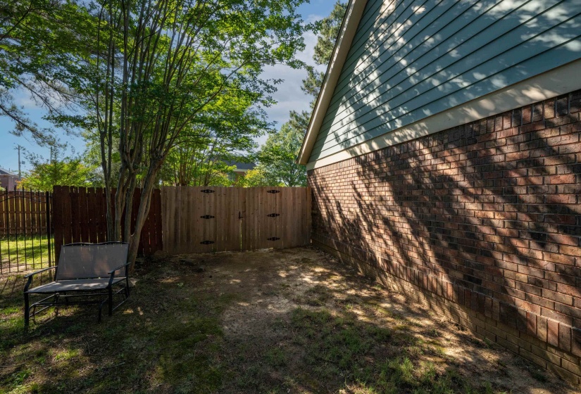 Exterior side featuring brick masonry and horizontal siding