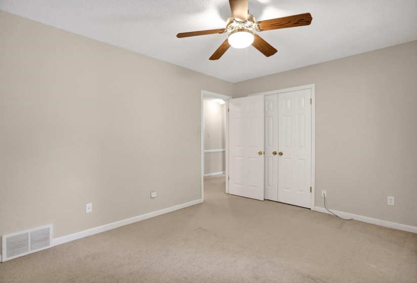 Neutral-toned wall paint and carpeted flooring