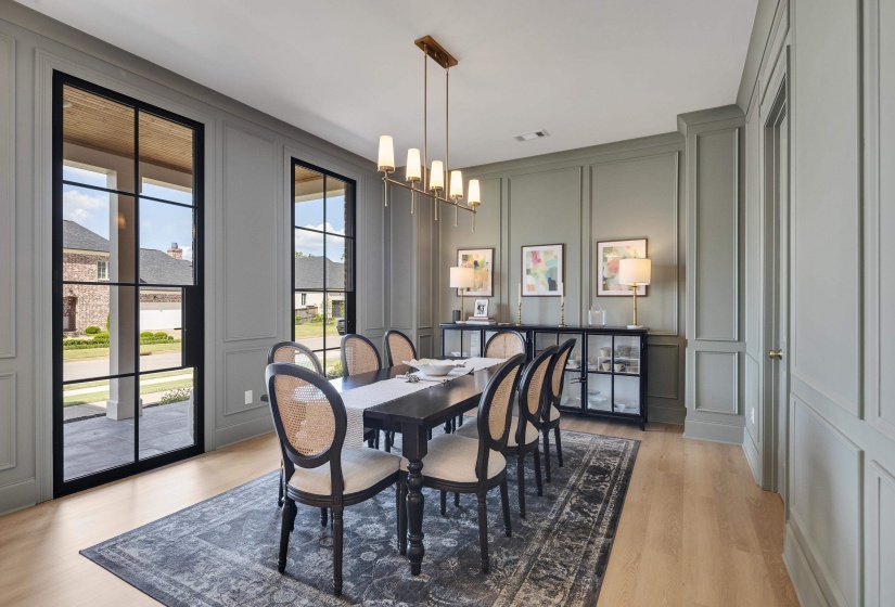 Light wood-finish flooring with a decorative area rug