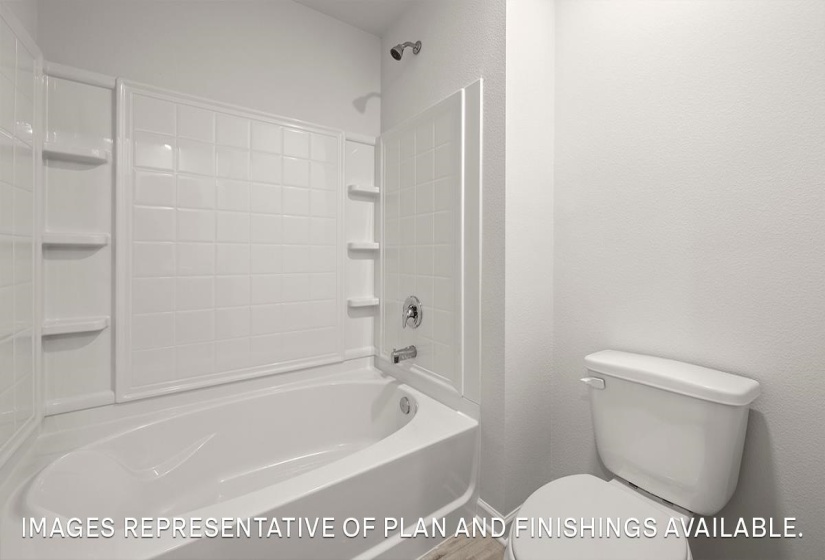 Full bath with bathing tub / shower combination and a textured wall