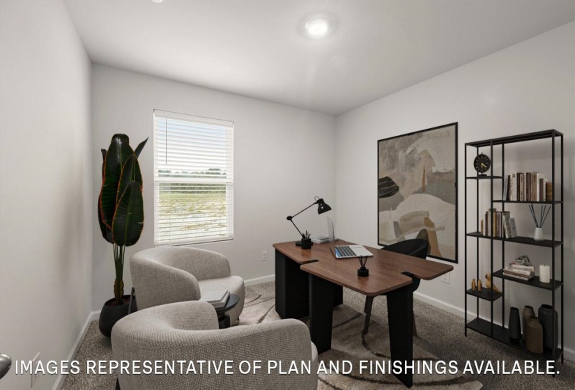 Carpeted home office featuring baseboards