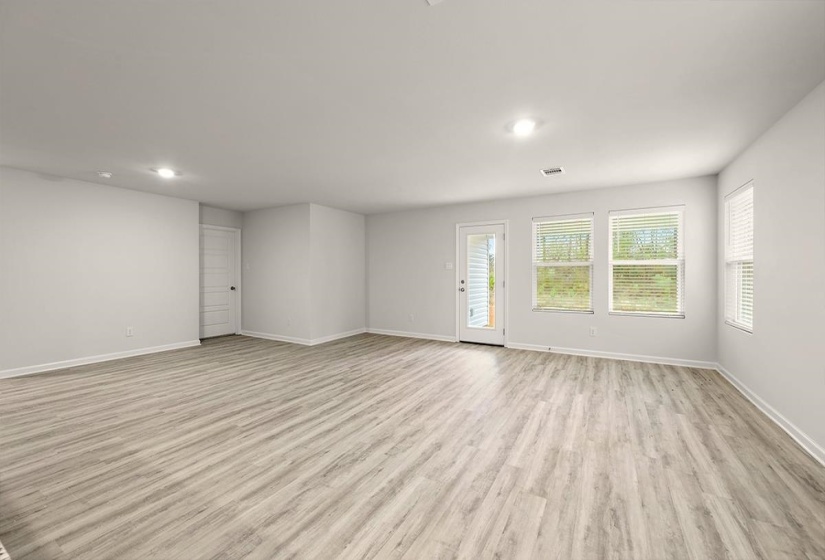 Unfurnished living room featuring light wood finished floors and recessed lighting