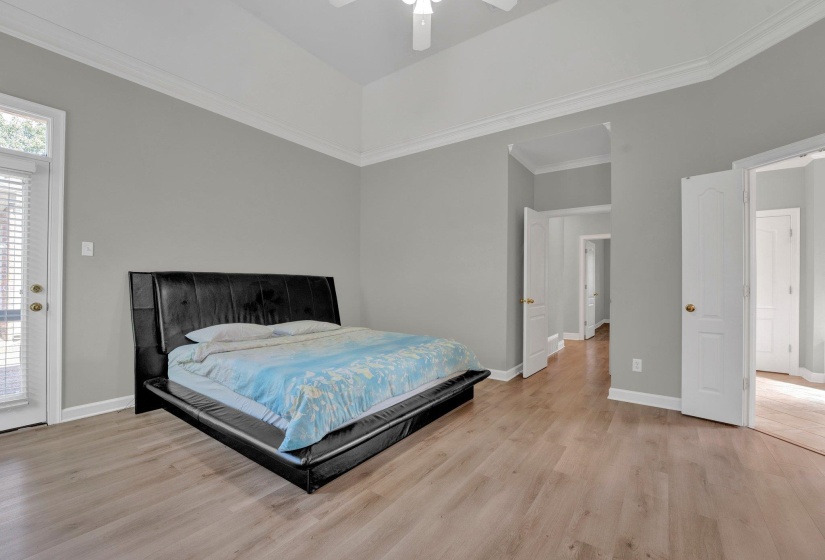 Bedroom featuring crown molding, light hardwood / wood-style floors, access to outside, and ceiling fan