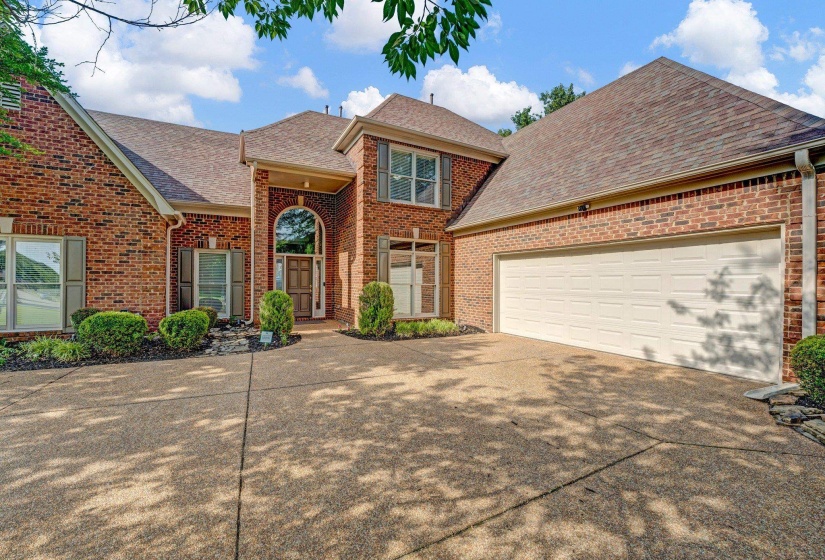 View of property featuring a garage