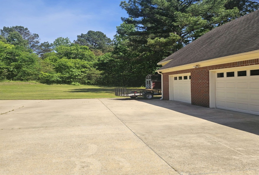 Expansive concrete driveway providing ample parking