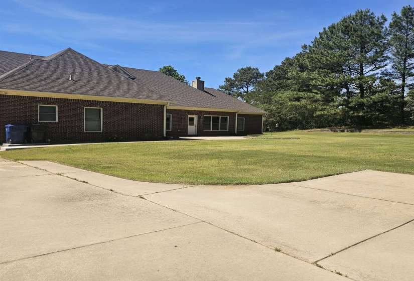 Brick exterior with a brown shingle roof