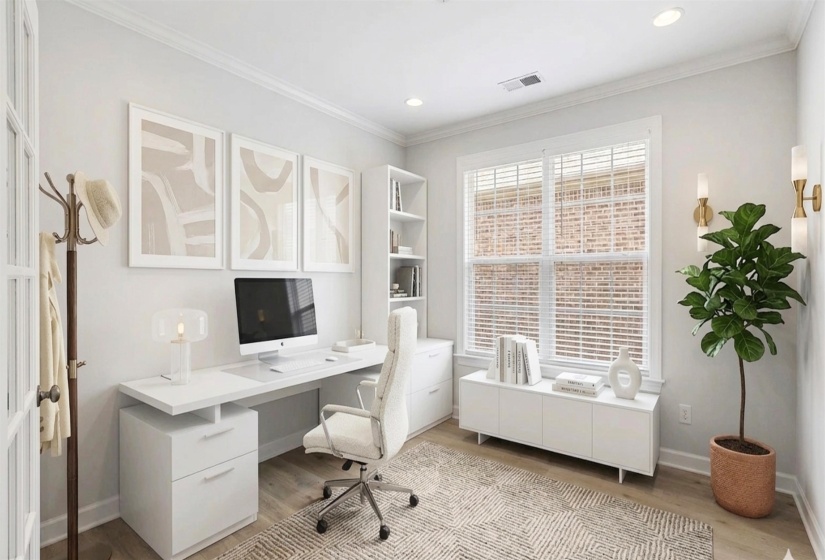 Brightly lit room featuring wood-finish flooring, crown molding, and built-in shelving