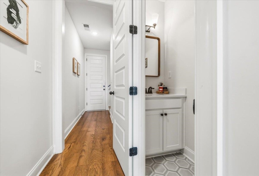 Hall featuring baseboards and light wood finished floors