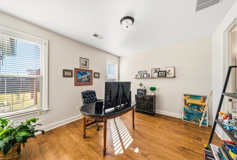 Office space featuring wood finished floors and baseboards