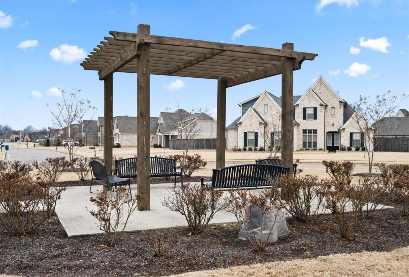 View of property's community featuring a patio, a residential view, and a pergola