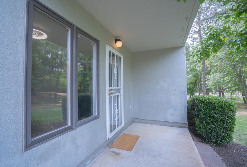 Entryway featuring a security screen door, an overhead light fixture, and two windows