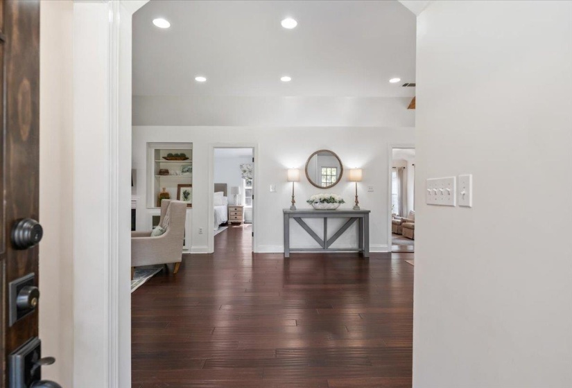 Rich wood-finish flooring extending throughout the main living areas