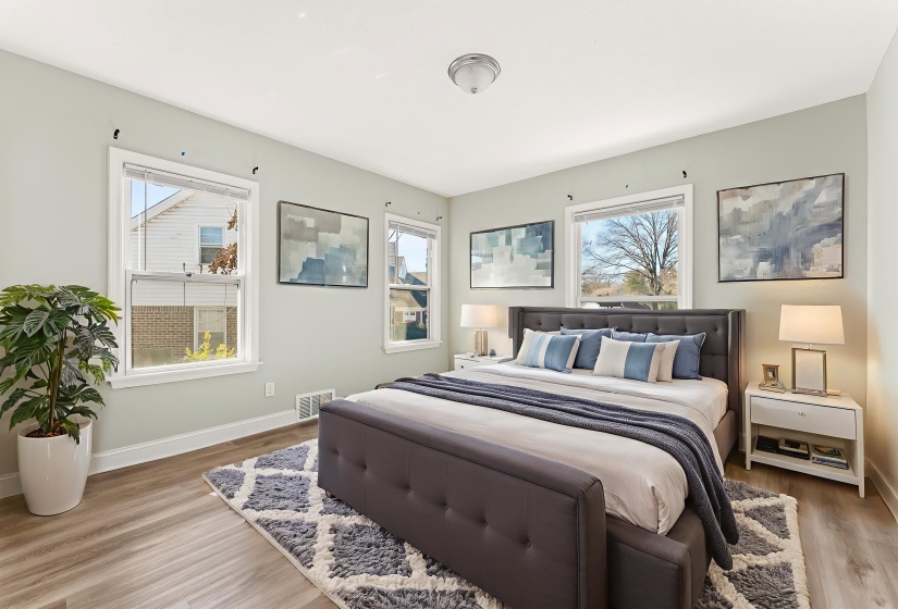 Bedroom featuring light wood finished floors and baseboards
