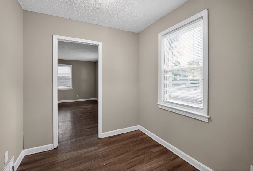 Neutral painted walls with wood-finish flooring