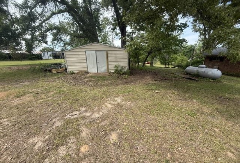 Corrugated metal storage shed with double doors