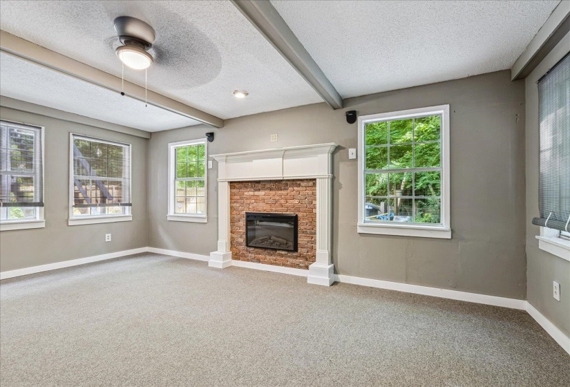 Located downstairs.New Carpet.Wood burning Fireplace.