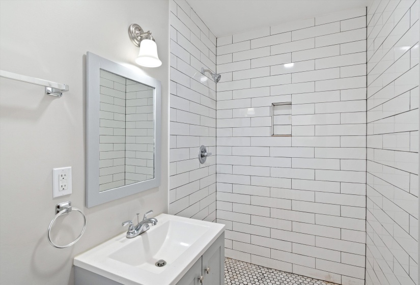 Bathroom with vanity and a stall shower