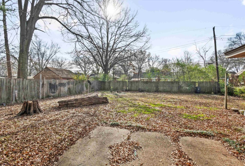 View of fenced backyard